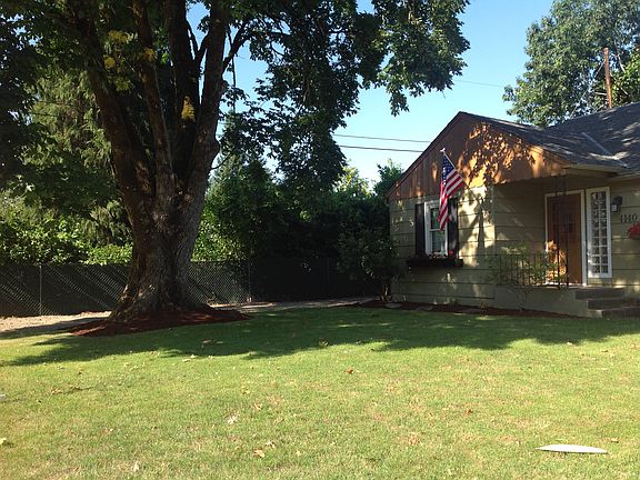 Front View with gravel drive