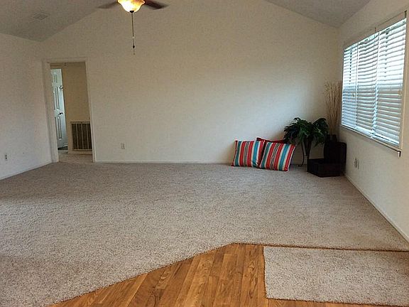 Notice wood laminate flooring and new carpet