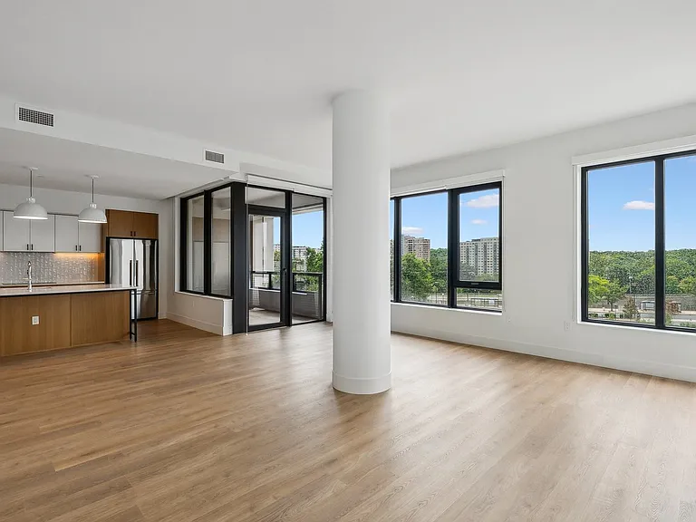 Expansive living room with ample natural light and views of the city
