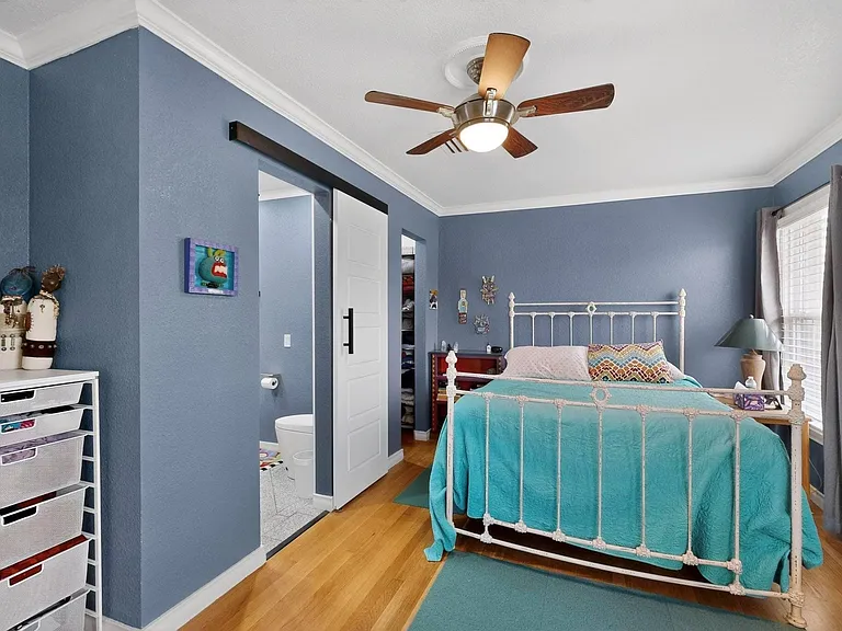 The primary bedroom with direct access to the bathroom, designed for convenience and comfort.