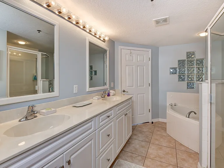 Spacious And beautiful master bathroom with Jacuzzi tub and step in shower enjoy a walk in closet