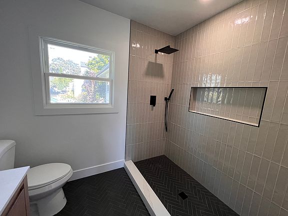 Primary suite glass shower will be installed shortly before move in.