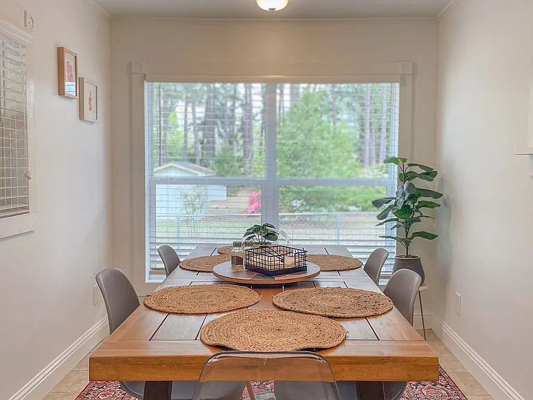 Huge windows connect you to the flora of the yards and wooded lot next door