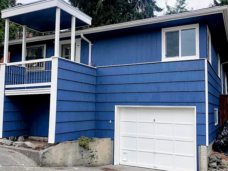 Front of home with single car garage extra deep for storage