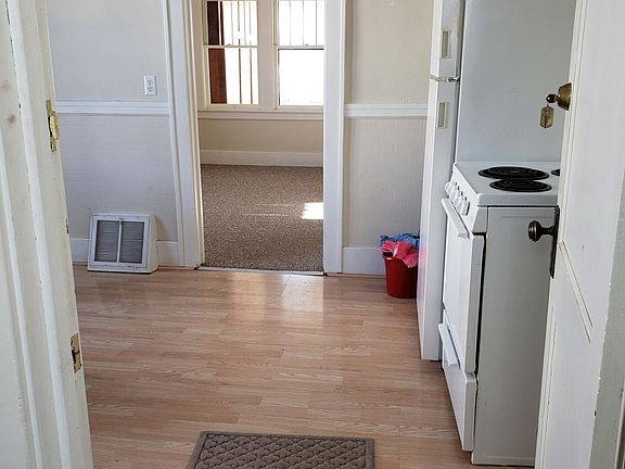 walking into the apartment looking through the kitchen to the living room.