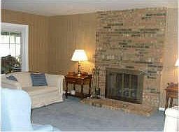 Nice size living room with gas log fireplace.