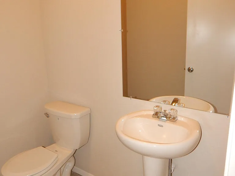 Half bath conveniently located on first level.