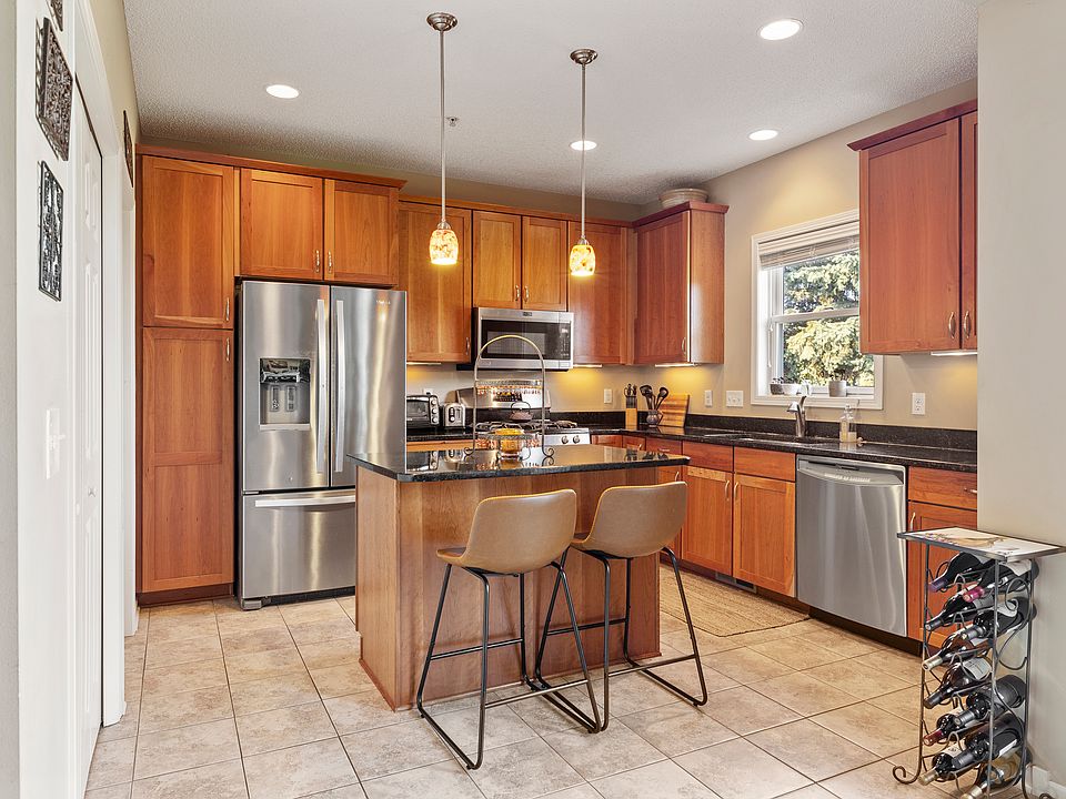 Maple cabinets, stainless steel, granite countertops.