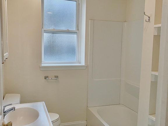 bathroom. comes with built in shelves.