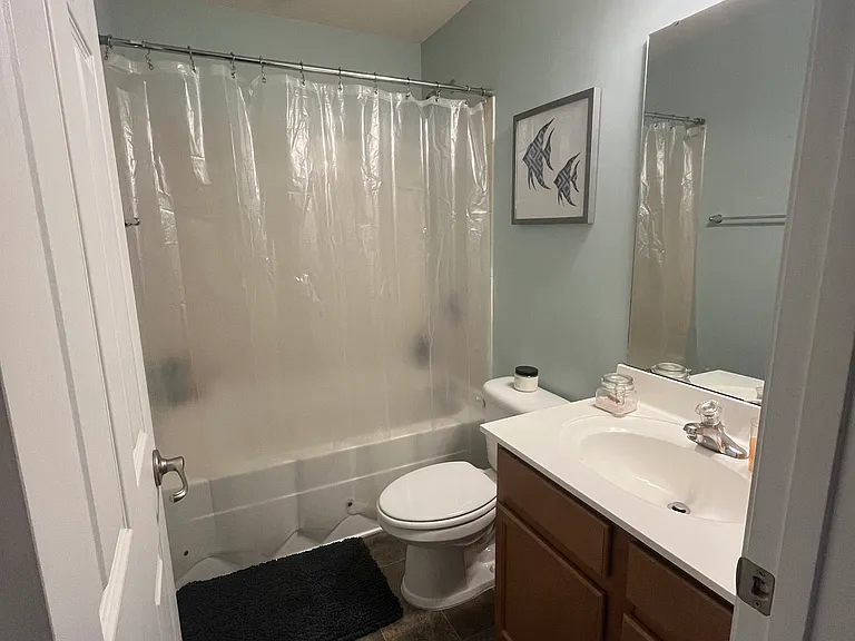 Full bath, upstairs. Current paint color.