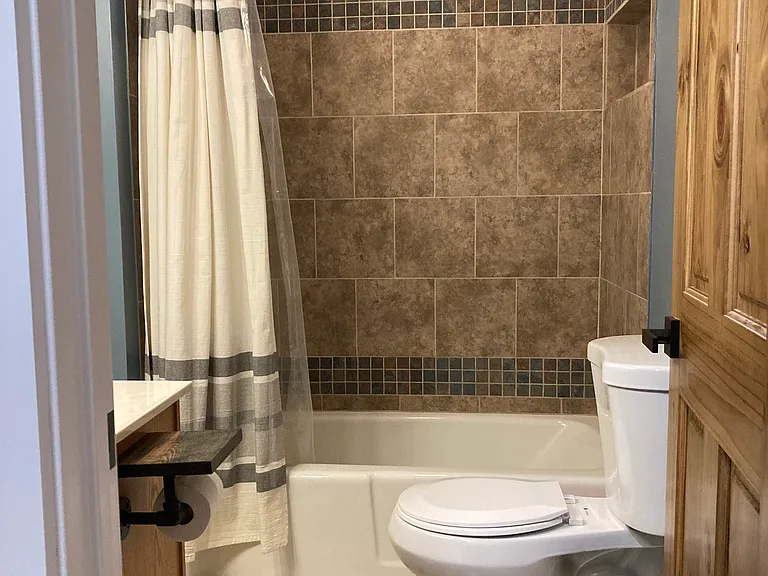 Second bathroom. Updated shower, toilet, and vanity.