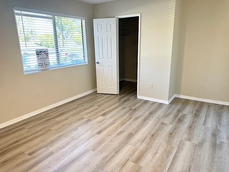 Master Bedroom with walk-in closet and new ceiling fan
