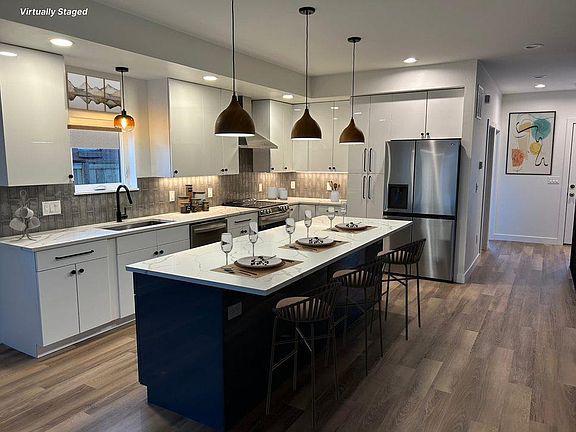 Large kitchen with huge island that can seat 4