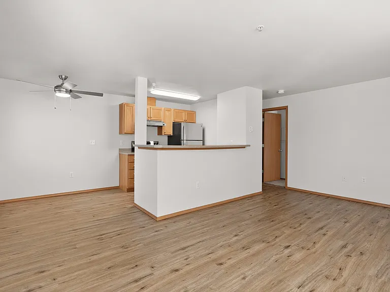 Bright open-concept kitchen with modern appliances and cozy wood flooring, perfect for entertaining. Bright open-concept kitchen with modern appliances and cozy wood flooring, perfect for entertaining.