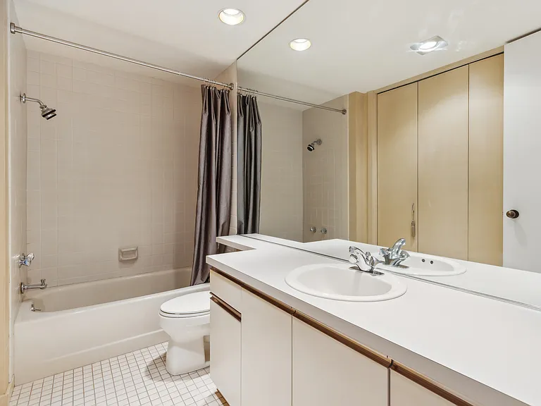 Bathroom with additional closet storage.