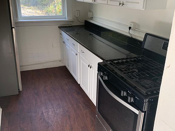1 of two Kitchens: stove, Stainless Steal Fridge, cabinets, granite Counter Tops!