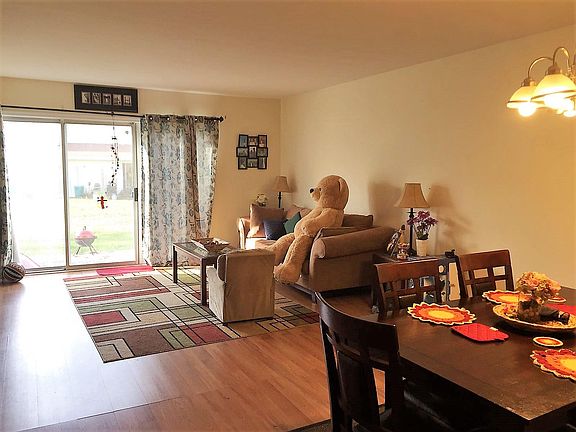 Huge and sunny living room with hardwood floors