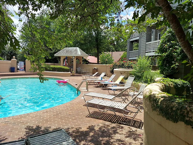 The Queens Station swimming pool is gunite, and complete with lounge chairs, and an outdoor grill for summer fun