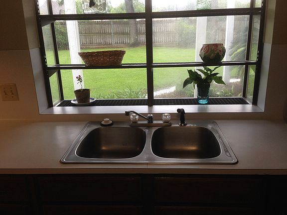 KITCHEN OVERLOOKS BACKYARD