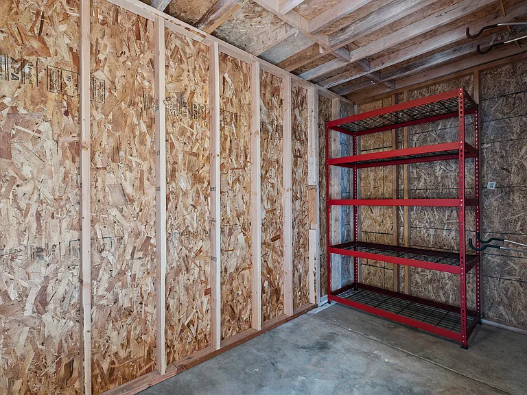 Separate storage unit comes with shelving and wall bike racks