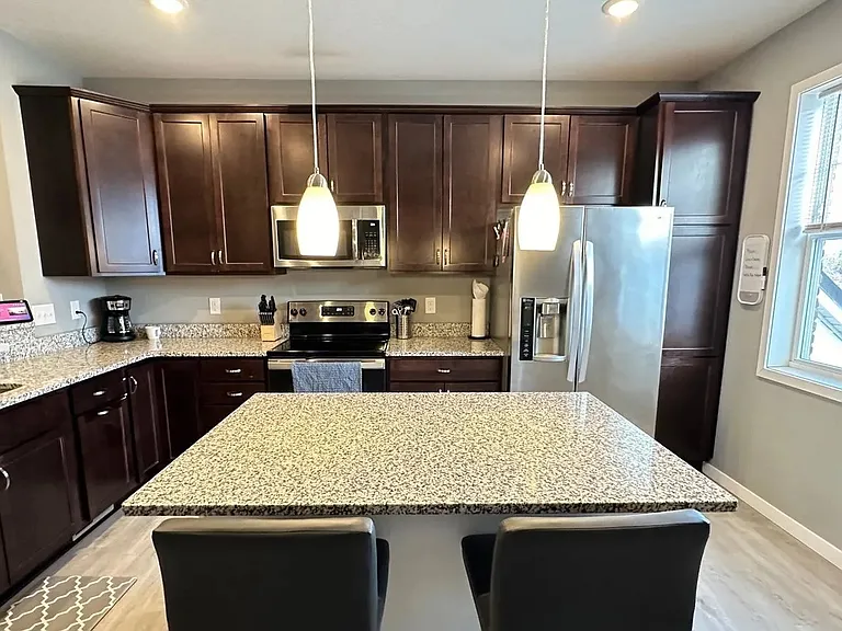 Step into modern elegance at LS Capital Group, where sleek design meets functionality in this gourmet kitchen. Enjoy granite countertops, stainless steel appliances, and ample space for entertaining. Schedule your tour today!