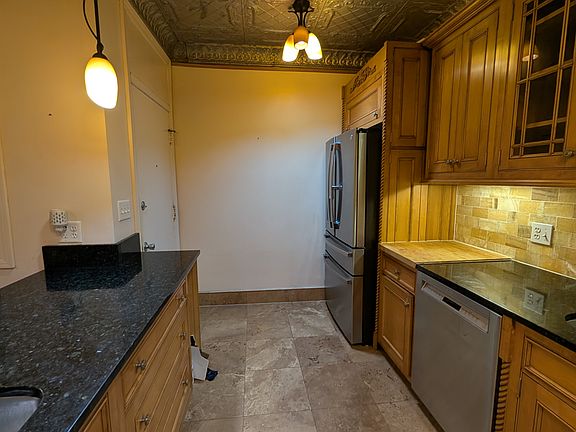 Kitchen with fridge and dishwasher