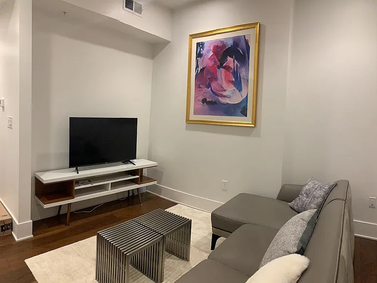 Living room with leather sofa chaise