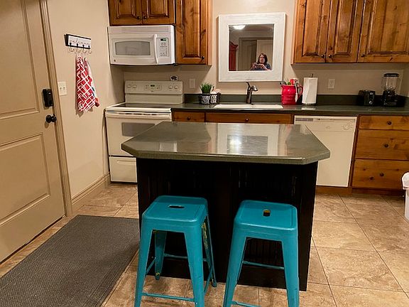 Fully stocked kitchen with large appliances, small appliances, and housewares.