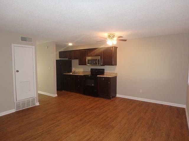 Living area looking into the stunning new kitchen. High qual
