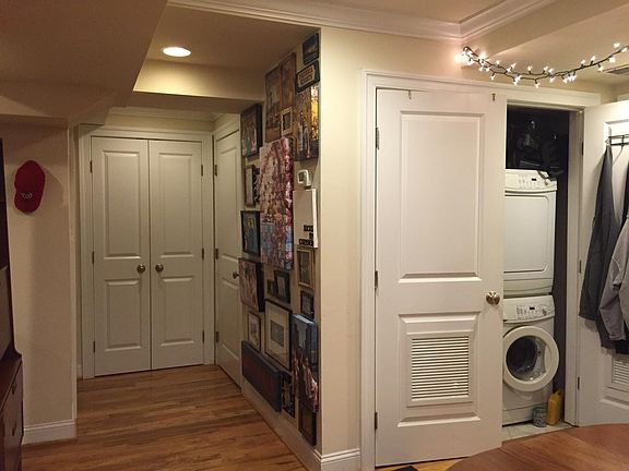 Washer and dryer and storage closet pictured here