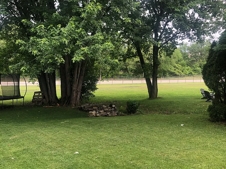 Flat level yard. Off street parking for this unit for two cars in addition to on street parking.