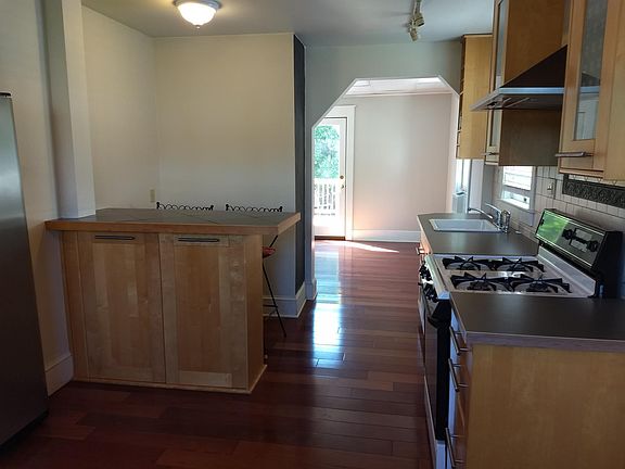 Looking into the dining room with Bar/Counter on left in kitchen.