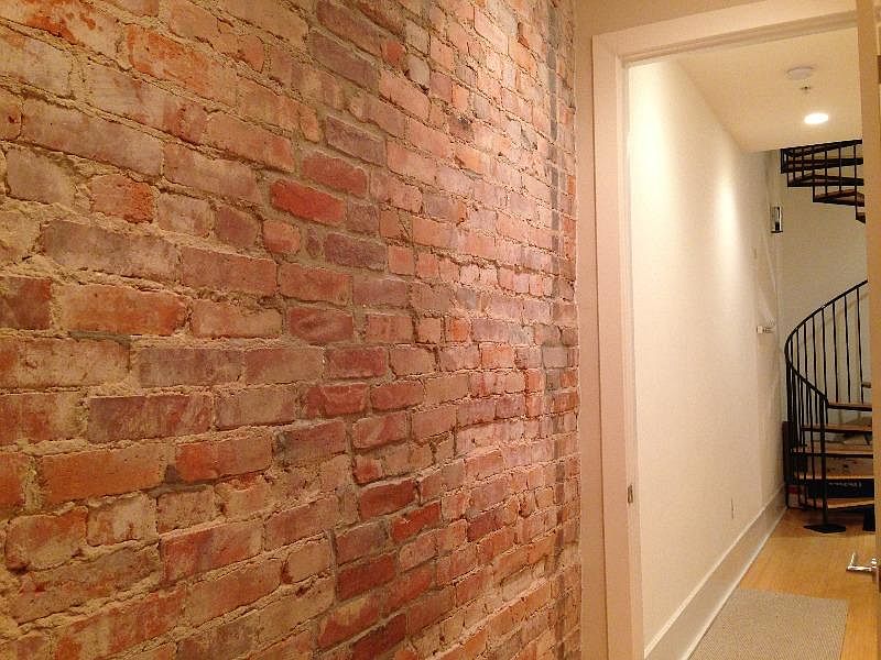 Hallway with exposed brick