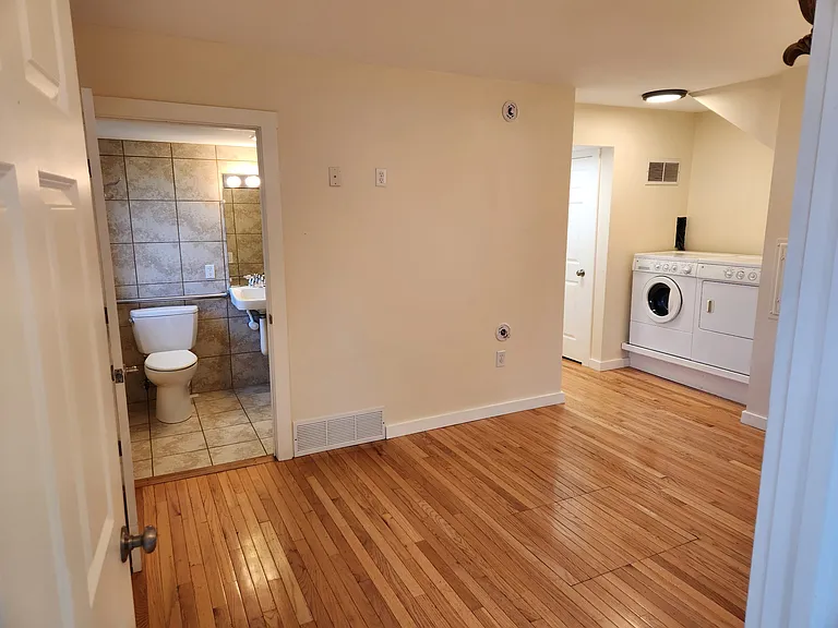Master bedroom showing ensuite bathroom and convenient laundry.