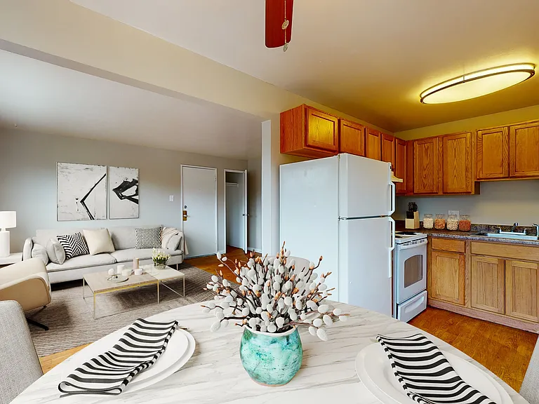 Inviting open-concept living area with modern kitchen, cozy seating, and stylish decor.