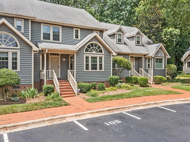 Beautiful townhome exterior with mature landscaping and an inviting neighborhood setting.