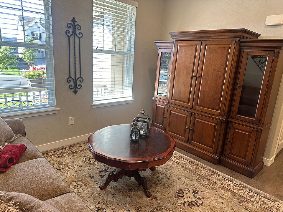 Beautiful living space with two large windows and all the natural light.