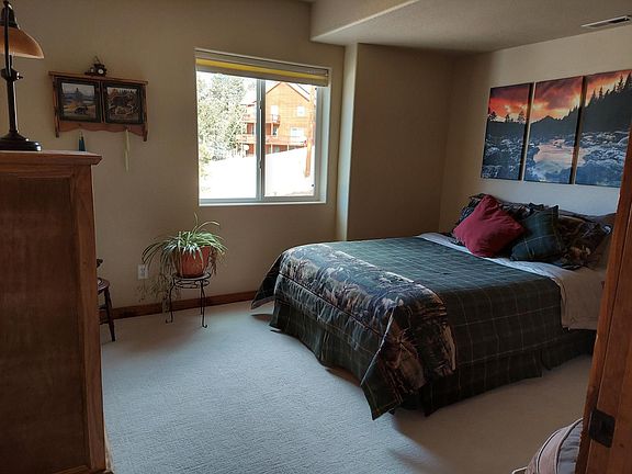 Fully furnished bedroom with queen size bed.