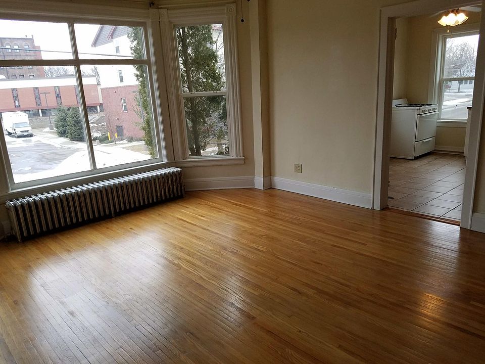 Large Beautiful wood floor with huge bay window living room