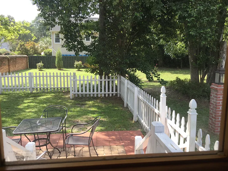 The kitchen opens directly onto a private patio overlooking the garden reserved exclusively for Aiken Luxury Rentals residents.