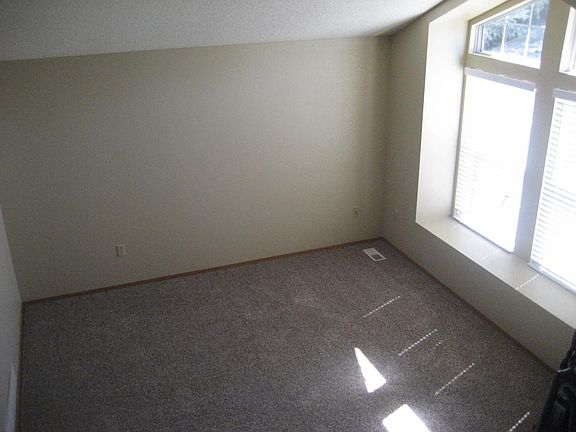 Open split level floorplan with large windwos and vaulted ce