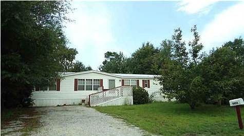 Front of house and driveway with room for an RV