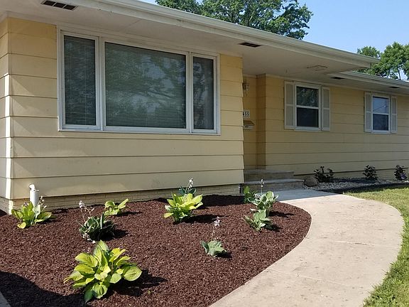 Nicely landscaped with hostas and hydrangeas