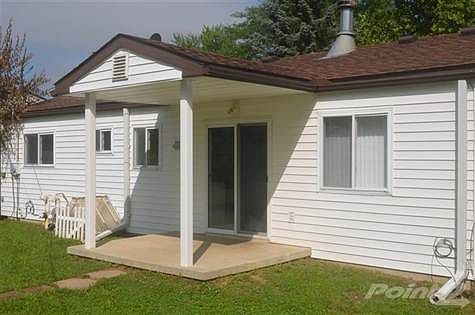 Covered patio off kitchen/dining area.