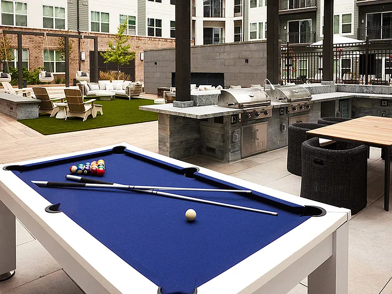 Built-in grills with dining areas and billiards table