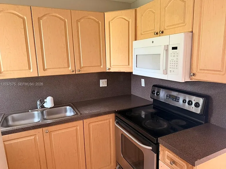 591 NW 65th St #104 — Photo 1
