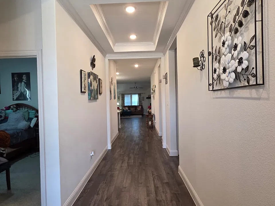 entry way with toll trey ceilings from main door