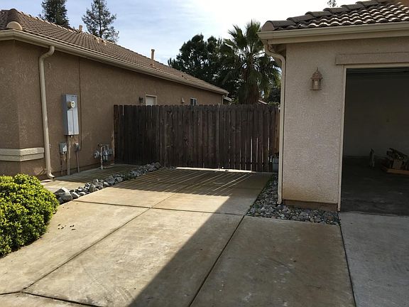 12'x46' cement side yard with double locking gates