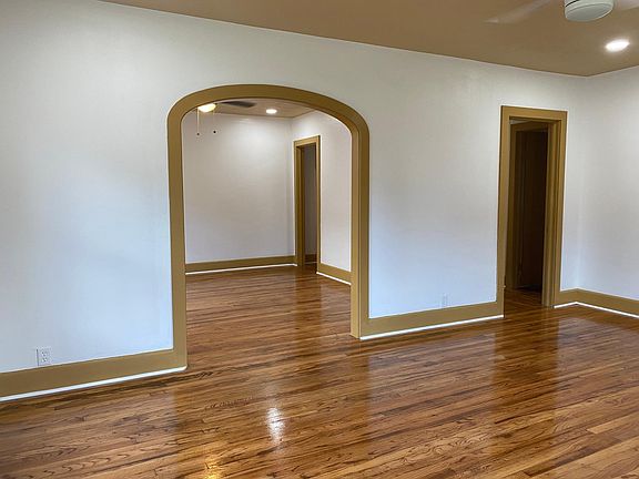 Living room, original hardwood floors throughout.