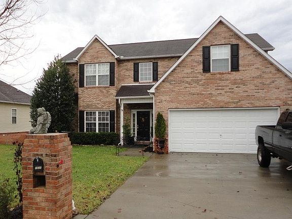 Brick front with 2 car garage.